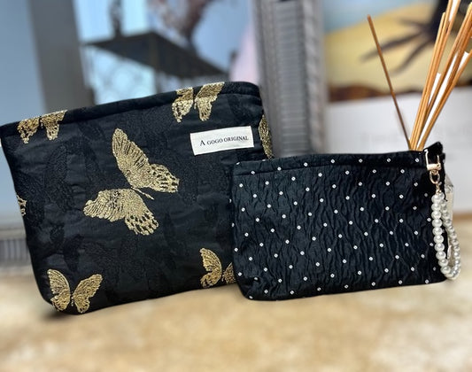 Sort quilted taske med perledetalje